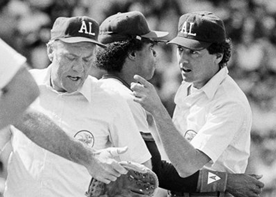 American League umpire Steve Palermo, right, is restrained by California Angels' Rod Carew after he and Angels' Bobby Grich got into an argument in Boston during a game on July 11, 1983. Former big league umpire Palermo, whose accomplished career ended when he was shot trying to break up a robbery in 1991, has died. He was 67.