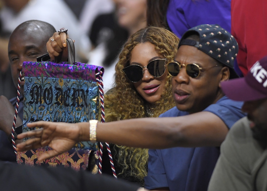 Beyonce and Jay Z watch during the first half in Game 7 of an NBA basketball first-round playoff series between the Los Angeles Clippers and the Utah Jazz in Los Angeles. (AP Photo/Mark J.