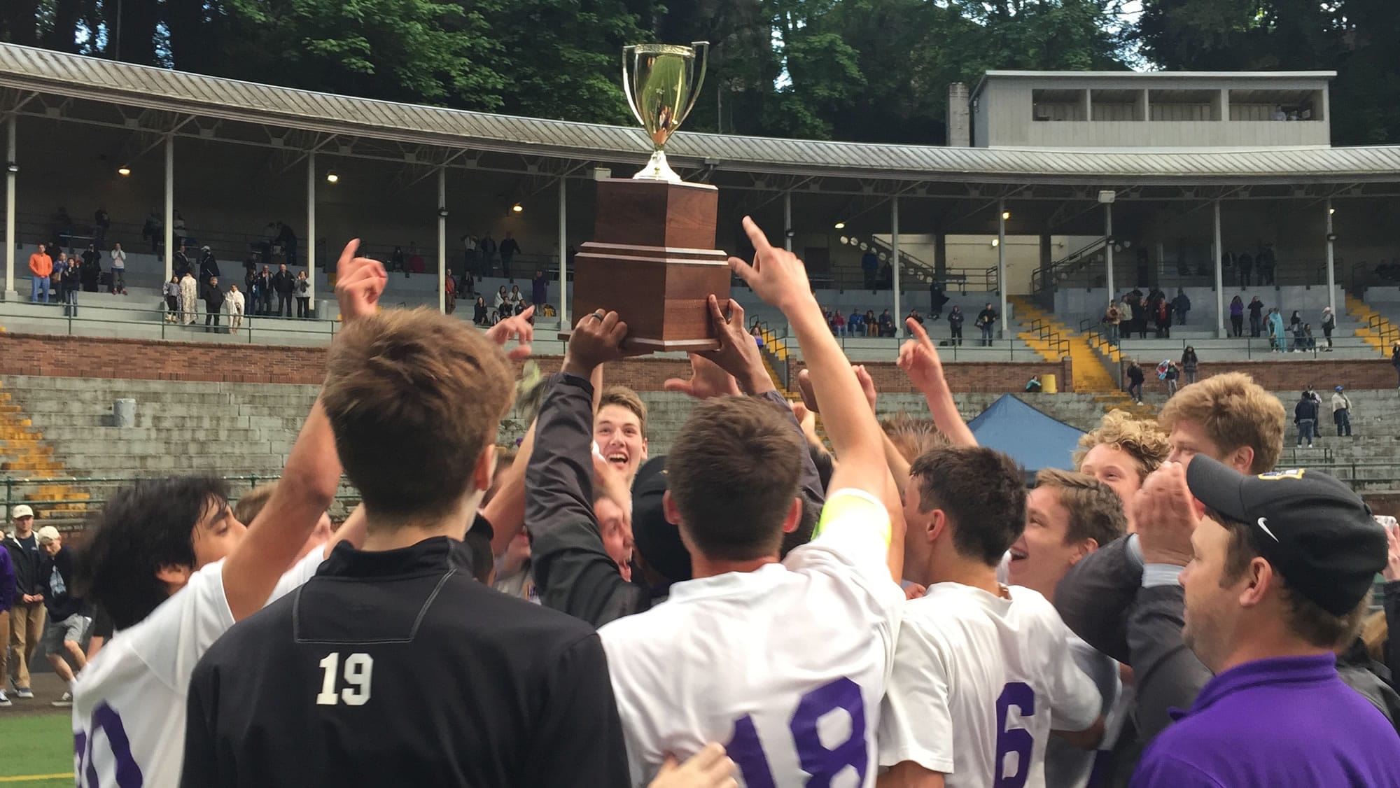 The Columbia River boys soccer team holds the District 4 championship trophy after beating Aberdeen 1-0 on Thursday at Kiggins Bowl.