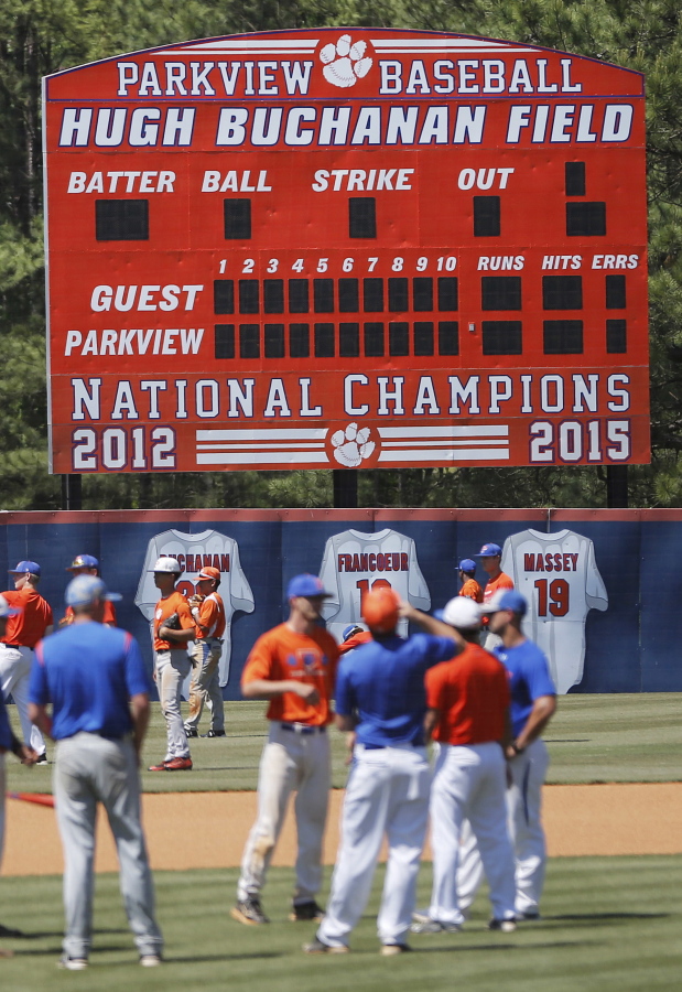 A scoreboard touts the accomplishments of the Parkview High School baseball team as they warm up before a baseball game April 26 in Lilburn, Ga. Older Parkview players in 2015 were disciplined for sexual battery.