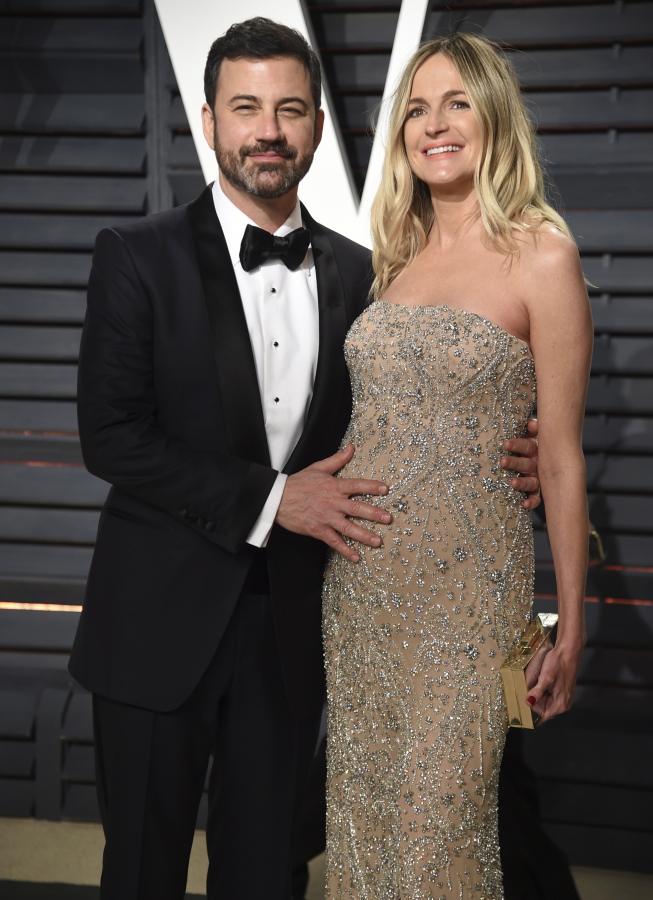 Jimmy Kimmel and his pregnant wife Molly McNearney arrive Feb. 27 at the Vanity Fair Oscar Party in Beverly Hills, Calif. On his show Monday night, the comedian tearfully described the emergency heart operation needed after his son, William John, was born on April 21.