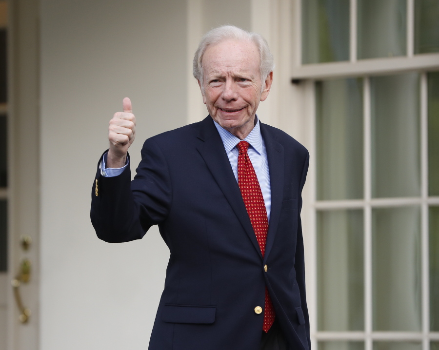 Former Connecticut Sen. Joe Lieberman gives a ‘thumbs-up’ as he leaves the West Wing of the White House in Washington on Wednesday. The White House says President Donald Trump will be interviewing four potential candidates to lead the FBI.