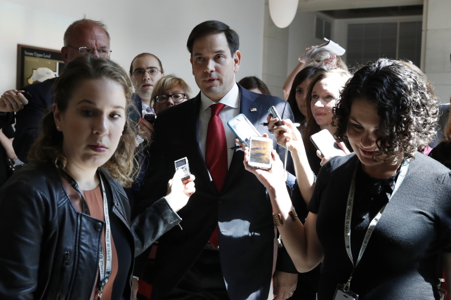 Sen. Marco Rubio, R-Fla., is surrounded by reporters as he leaves a briefing of the full Senate by Deputy Attorney General Rod Rosenstein, amid controversy over President Donald Trump’s firing of FBI Director James Comey, at the Capitol, May 18 in Washington.