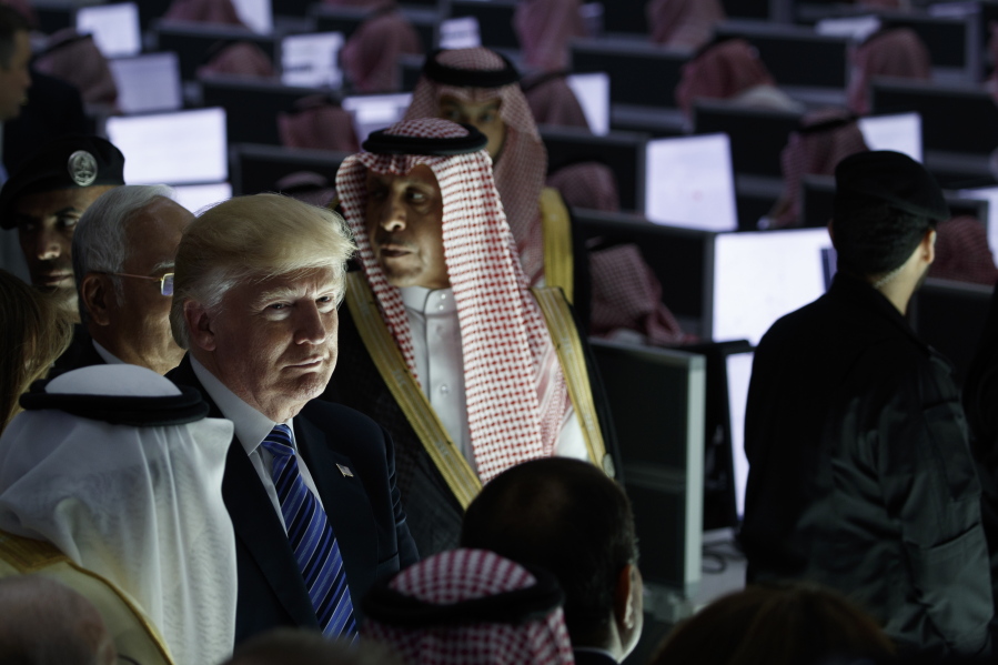 President Donald Trump listens during a ceremony to mark the opening of the Global Center for Combatting Extremist Ideology on Sunday in Riyadh.