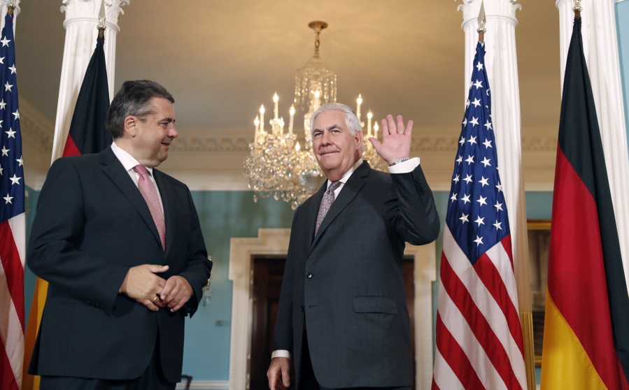 German Foreign Minister Sigmar Gabriel watches as Secretary of State Rex Tillerson waves as they depart after a photo opportunity at the State Department in Washington on Wednesday.