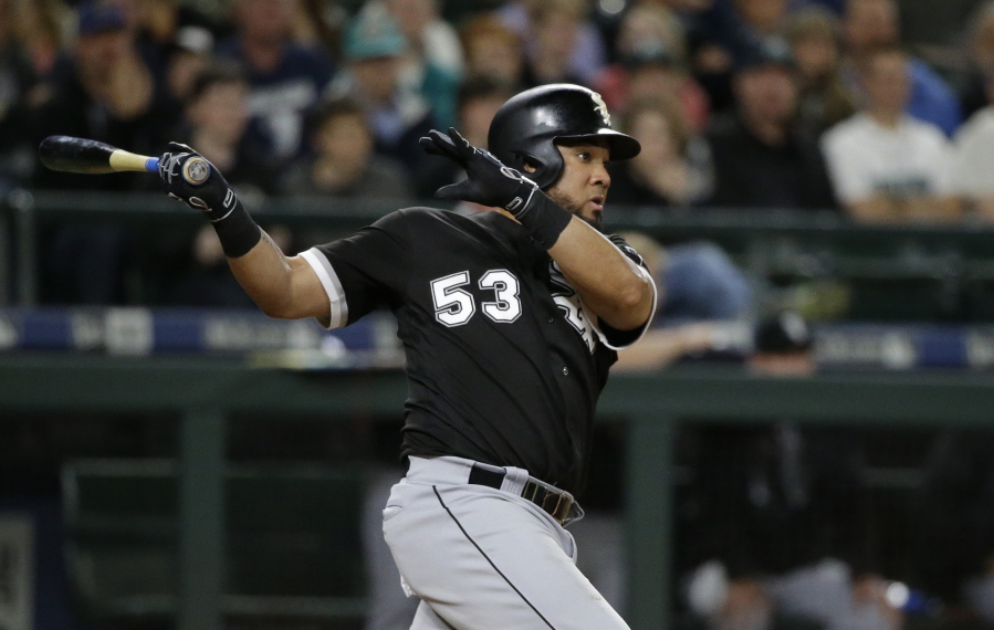 Chicago White Sox's Melky Cabrera watches his go-ahead RBI double in the 10th inning of a baseball game against the Seattle Mariners, Friday, May 19, 2017, in Seattle. Leury Garcia scored on the play. (AP Photo/Ted S.