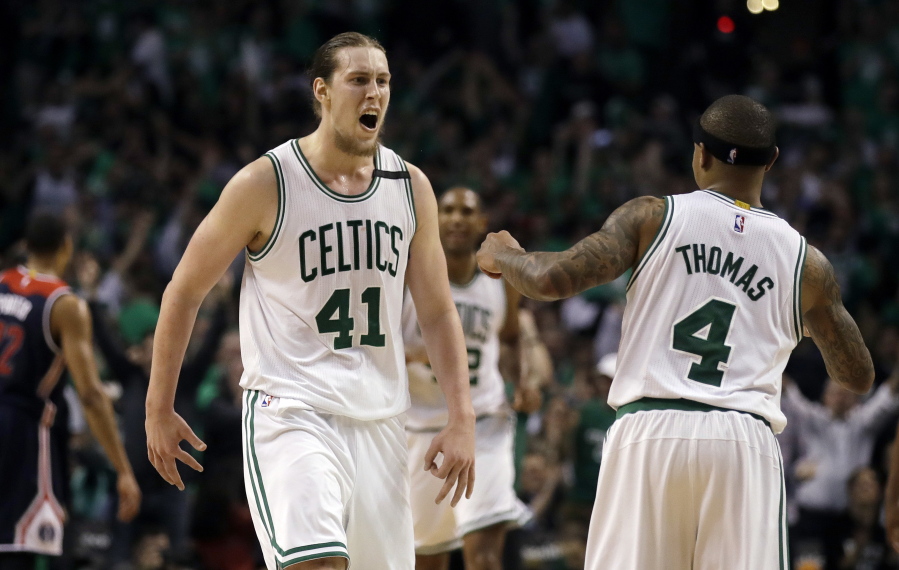 Boston Celtics center Kelly Olynyk (41) celebrates his basket with guard Isaiah Thomas (4) during the fourth quarter of Game 7 of a second-round NBA basketball playoff series against the Washington Wizards, Monday, May 15, 2017, in Boston.