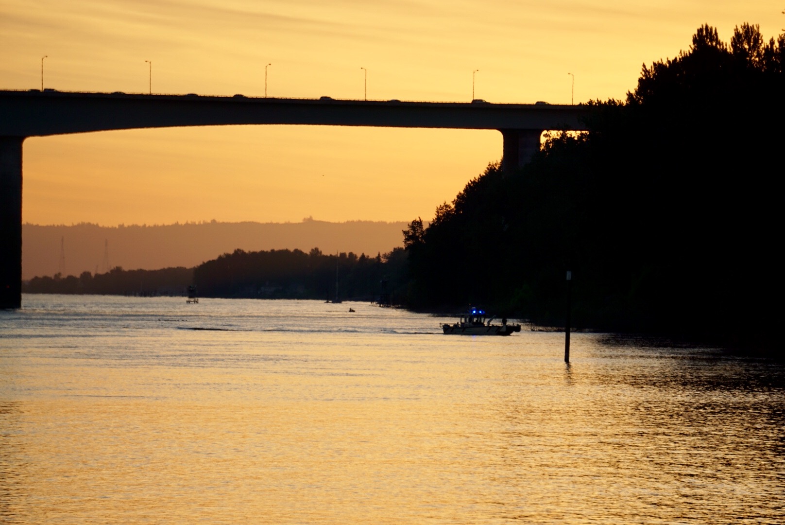 A rescue boat works at the scene of a fatal accident on the Columbia River Monday evening. A woman was killed and a man was injured when their boat struck a bridge pier and sank.