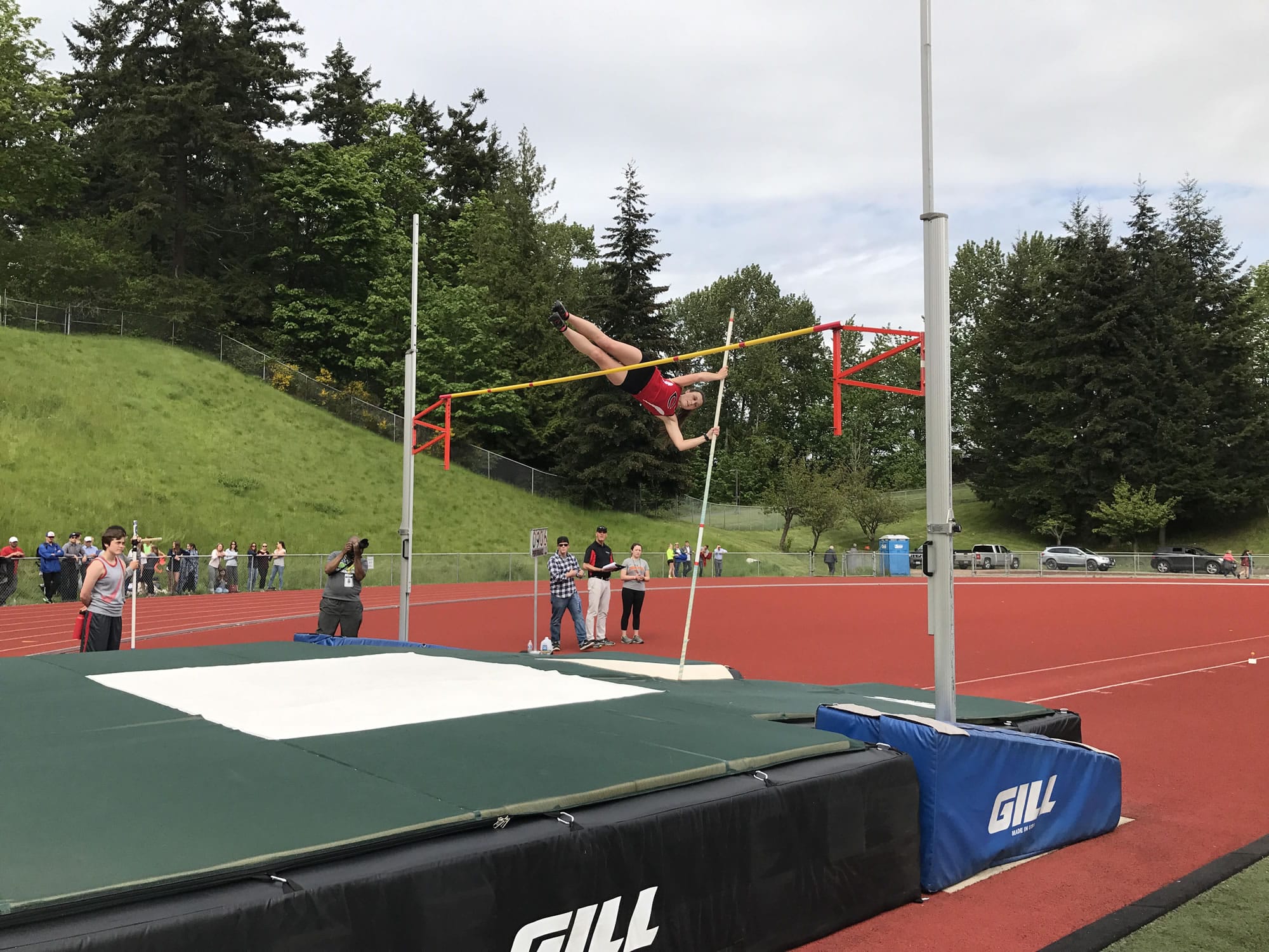 Riley Truitt of Camas clears the bar on her way to qualifying for state in the pole vault at the 4A bi-district meet in Kent (Meg Wochnick/The Columbian)