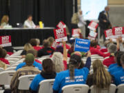 Supporters on both sides of the coal export issue attend a Millennium Bulk Terminals Longview Environmental Impact Statement Scoping meeting at the Clark County Fairgrounds Event Center in 2013.