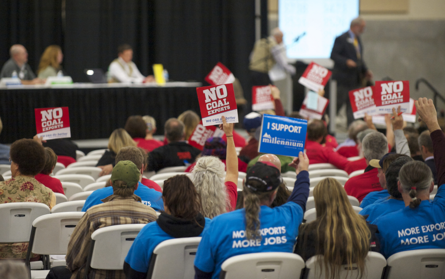 Supporters on both sides of the coal export issue attend a Millennium Bulk Terminals Longview Environmental Impact Statement Scoping meeting at the Clark County Fairgrounds Event Center in 2013.