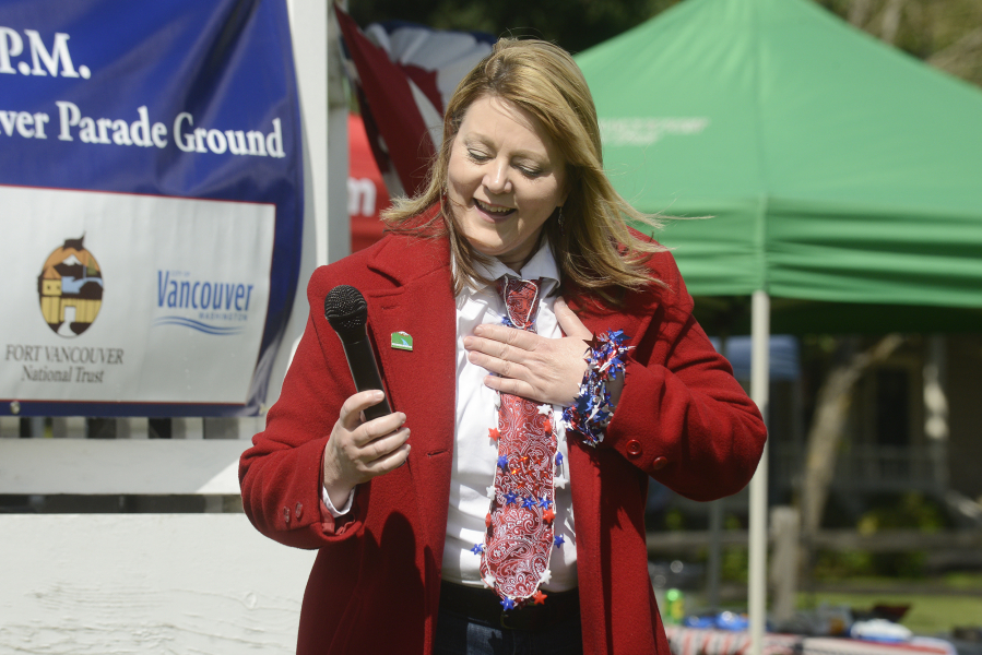 Marilee McCall, mayor pro tem of Woodland, describes her entry in the mayors’ patriotic tie contest during the 2016 Flag Day celebration at Fort Vancouver.