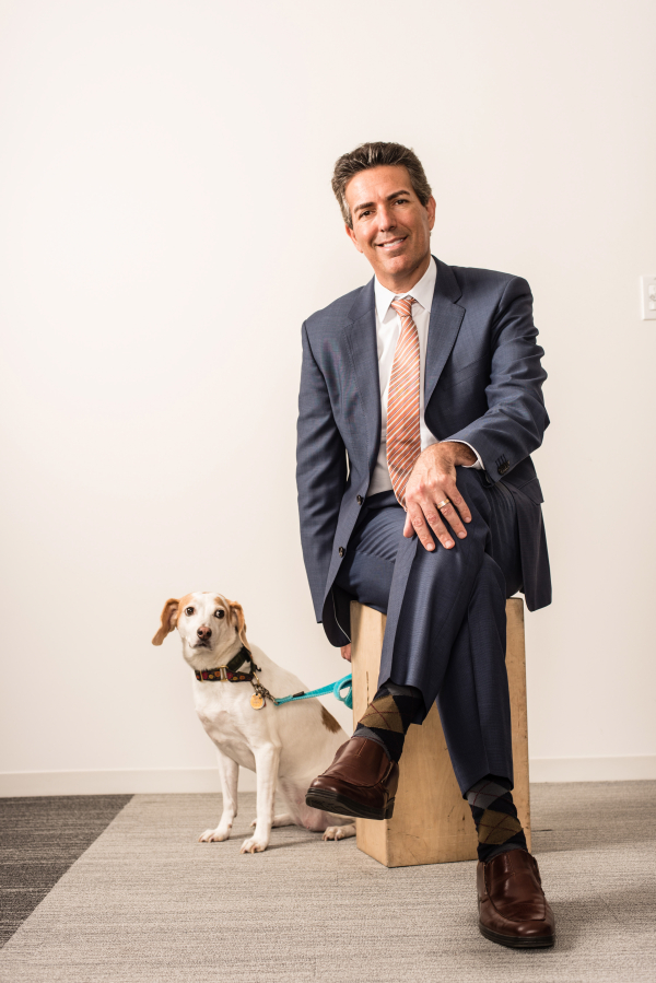 Wayne Pacelle, president and CEO of the Humane Society of the United States, poses with his dog, Lily.