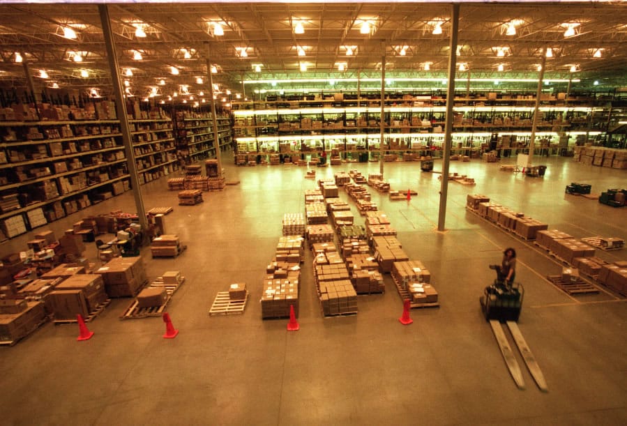 From a vast concrete floor rises stacks of outbound packages, inventory from Amazon.com’s then-new Nevada facility in 2001.