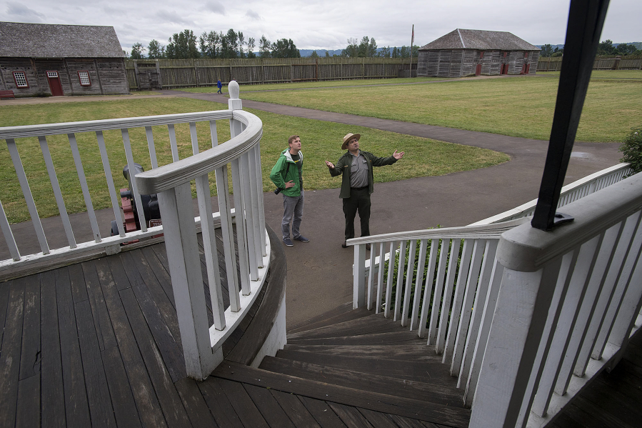 Mikah Meyer, left, 31, who is trying to become the first person to visit all 417 national parks during one road trip, learns about Fort Vancouver National Historic Site during a June 16 tour with Bob Cromwell, chief of interpretation.