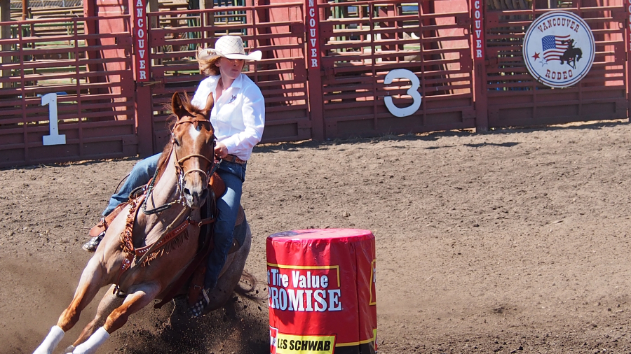 Barrel racer Hope Lutrell of Carlton, Ore., rounds the final barrel during a Vancouver Rodeo session in 2015. The Vancouver Rodeo is four evenings of classic contests for cowboys and cowgirls.