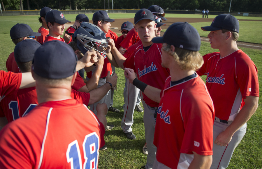 Vancouver Cardinals players gather before taking to the field against the Federal Way Buzz in the Curt Daniels Invitational Baseball Tournament.
