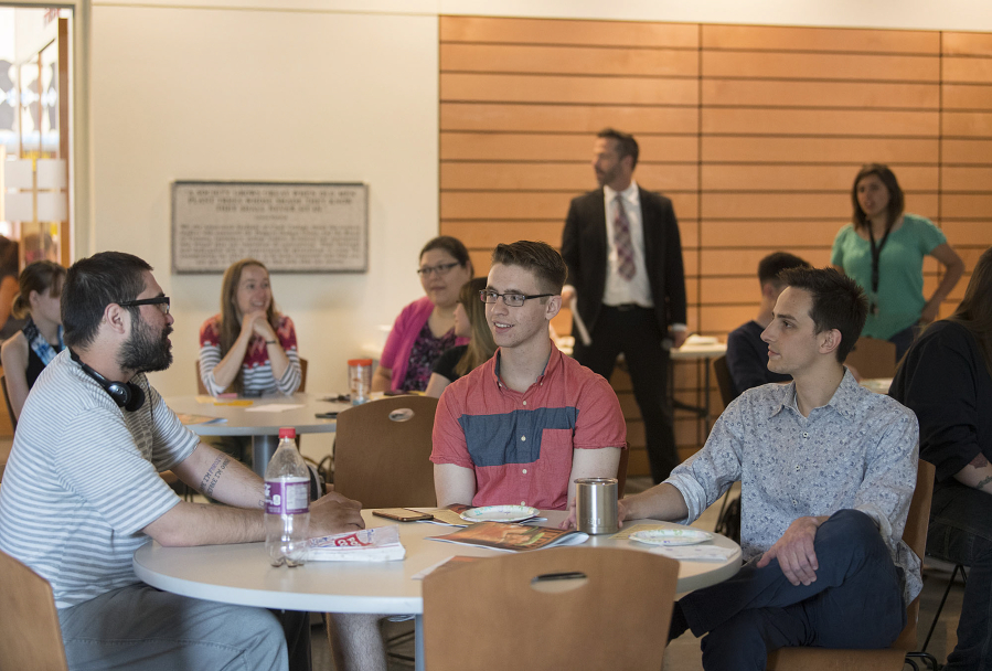 Clark College students Stephen Parra, from left, Jr Bundy and Andrew Gebe discuss their experiences with fake news during a workshop at Clark College on Wednesday. The college’s student newspaper, The Independent, organized the workshop.