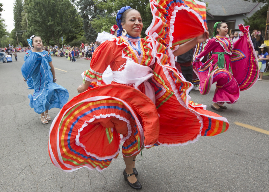 Dancers from the Mexican restaurant El Rancho Viejo take part in the Fourth of July Parade through Ridgefield in 2016.