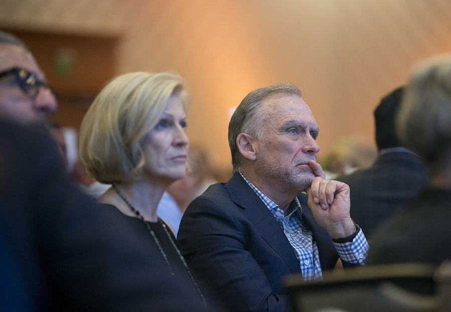 Philanthropists Michele Goodwin, left, and her husband, Greg, listen to speakers during a luncheon at the Hilton Vancouver Washington on Tuesday afternoon. They were recognized as the 2017 philanthropists of the year.