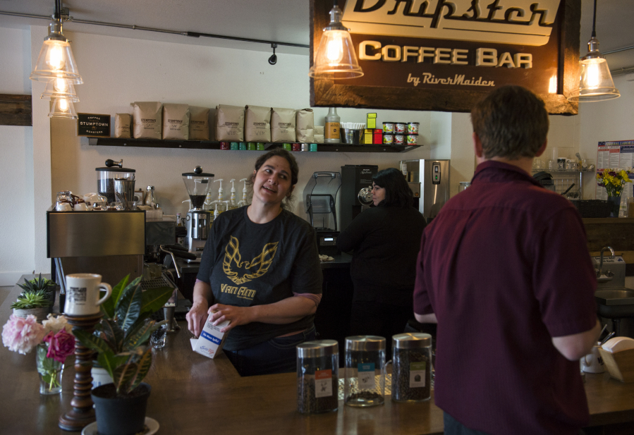 River Maiden Artisan Coffee co-owner Melissa Layman chats with a customer about having to close the shop at the end of the month. Layman and fellow co-owner Aaron Flies said they did not want to sign a 10-year lease and hope to open in a new location by fall.