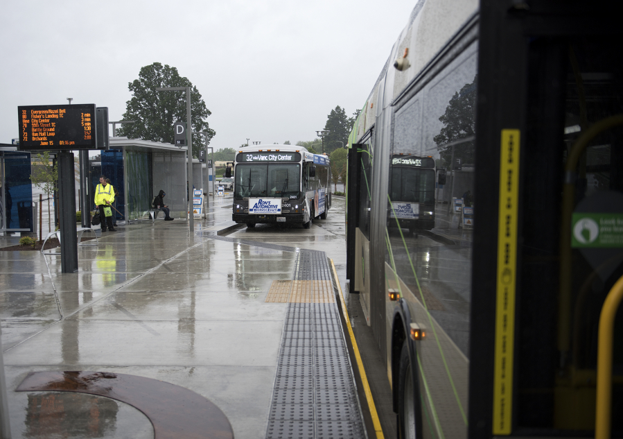 Buses idle while awaiting passengers at the southside Vancouver Mall Transit Center. The station, which was moved from the north side of the mall last January, was one of several changes C-Tran has undergone in the last year in an effort to improve its service.