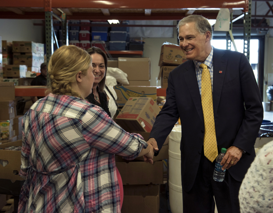 Gov. Jay Inslee met with staff of Share, a homeless service provider, in Southwest Washington on Friday. The governor is championing measures to help maintain funding for Share in the state’s budget. Inslee made several other stops while in town, including at the Washington State School for the Blind, where he made remarks during the commencement ceremony.