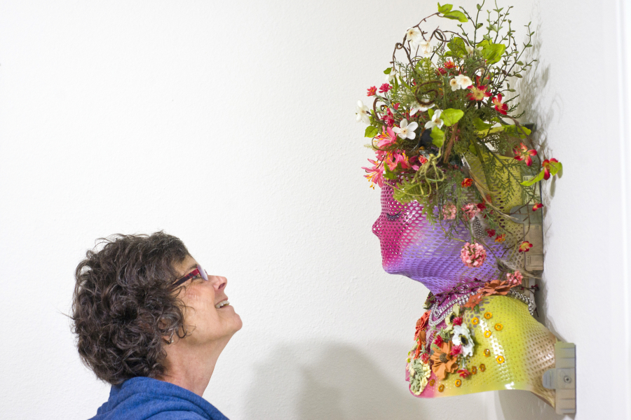 Beri Trestrail transformed the mask used during radiation treatment for tonsil cancer into a work of art that she proudly hangs on a wall in her Vancouver home. The mask, Trestrail said, represents the beautiful new life she has now that she has completed treatment.