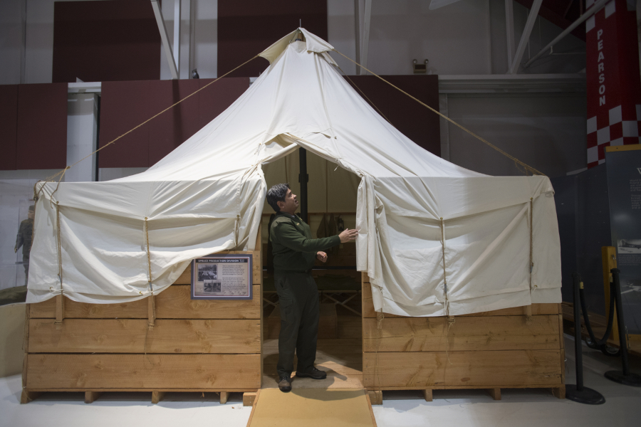 Bob Cromwell, manager of Pearson Air Museum, looks over a tent that was built to century-old specs by the company that made the original spruce mill tents for Vancouver Barracks during World War I.