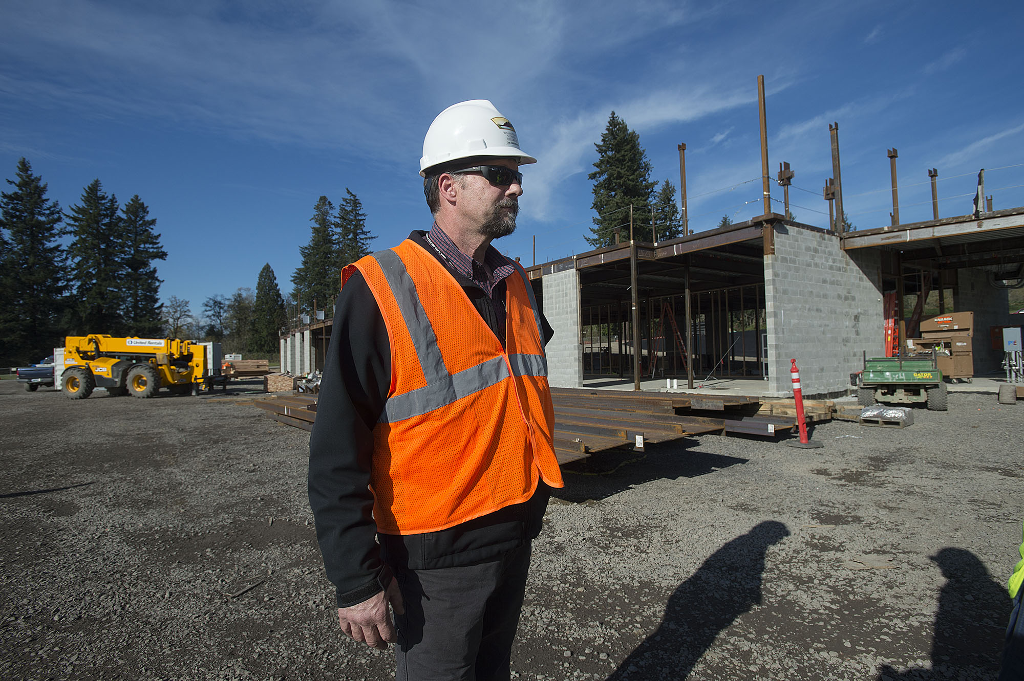 Joe Steinbrenner of the Washougal School District stands outside the new elementary school under construction in Washougal in November. The new school will be open this fall and will effect start times and bus routes for other schools in the district.