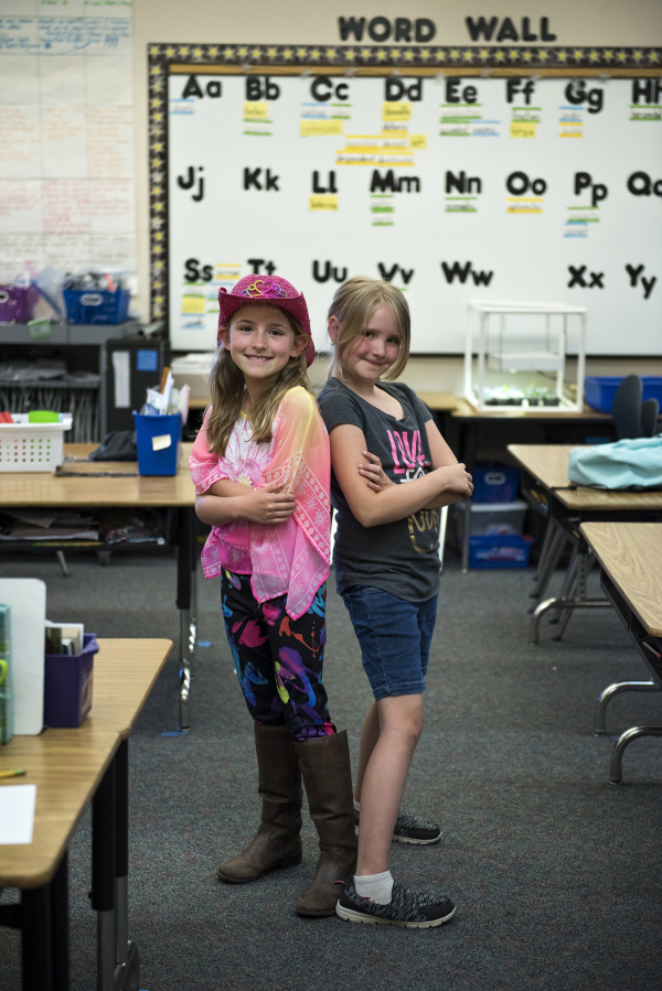 Hockinson Heights Elementary School second-graders Makena Nelson, left, and Kaylin Oliver rushed to notify adults during a recent lunch period that a friend of theirs was choking on a potato chip. Adults performed the Heimlich maneuver.