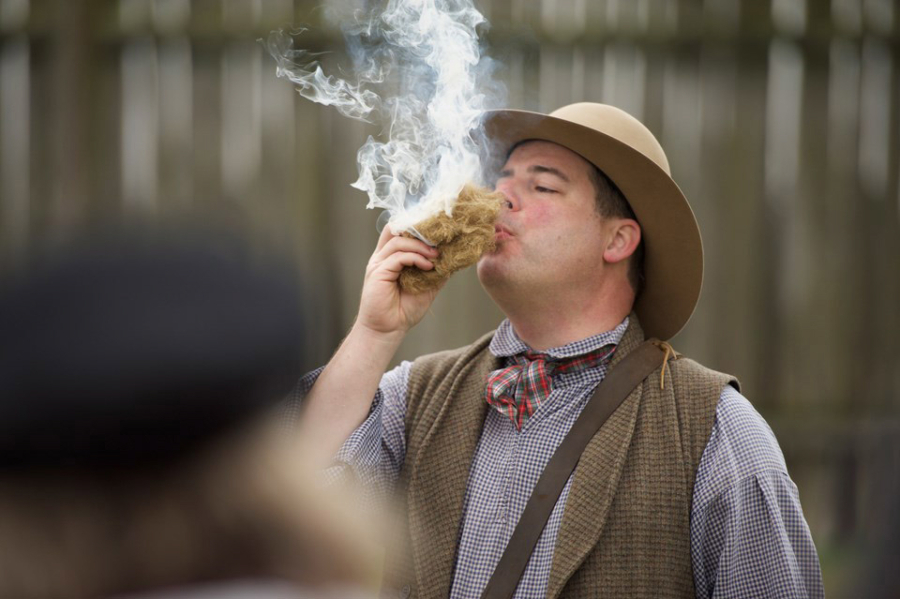 Mike Twist, National Park Service ranger, shows how to make fire with flint and steel and a handful of tinder during a living history program at Fort Vancouver National Historic Site.