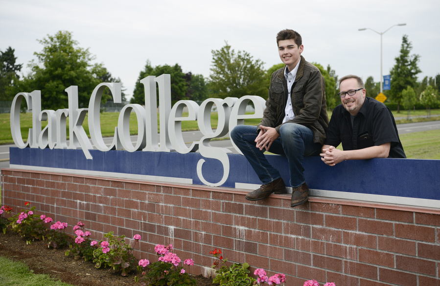 Clark College students, Brady Johnson, left, and Brady’s father, Kelly Johnson, are pictured with the Clark College sign. Kelly Johnson returned to school after being away for 27 years. Both father and son are in the supervisory management program at Clark.