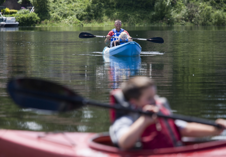 Brian Morris goes takes to Horseshoe Lake with his children Caroline, 4, and Dayton, 6, (in foreground) as part of their increasingly regular trips to Woodland Planters Days, which was over the weekend. That it was Father’s Day as well was kind of an added perk, Morris said.