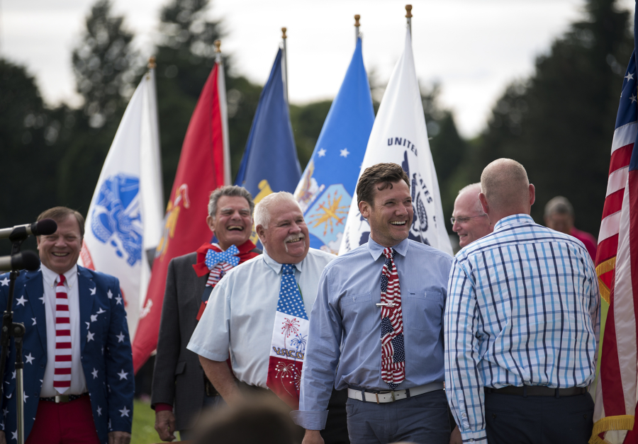 Steve Hogan, Camas mayor pro tem, from left, Ridgefield Mayor Ron Onslow, Yacolt Mayor Jeff Carothers and Vancouver Mayor Tim Leavitt display their patriotic ties Wednesday during Fort Vancouver’s 23rd annual Flag Day celebration.