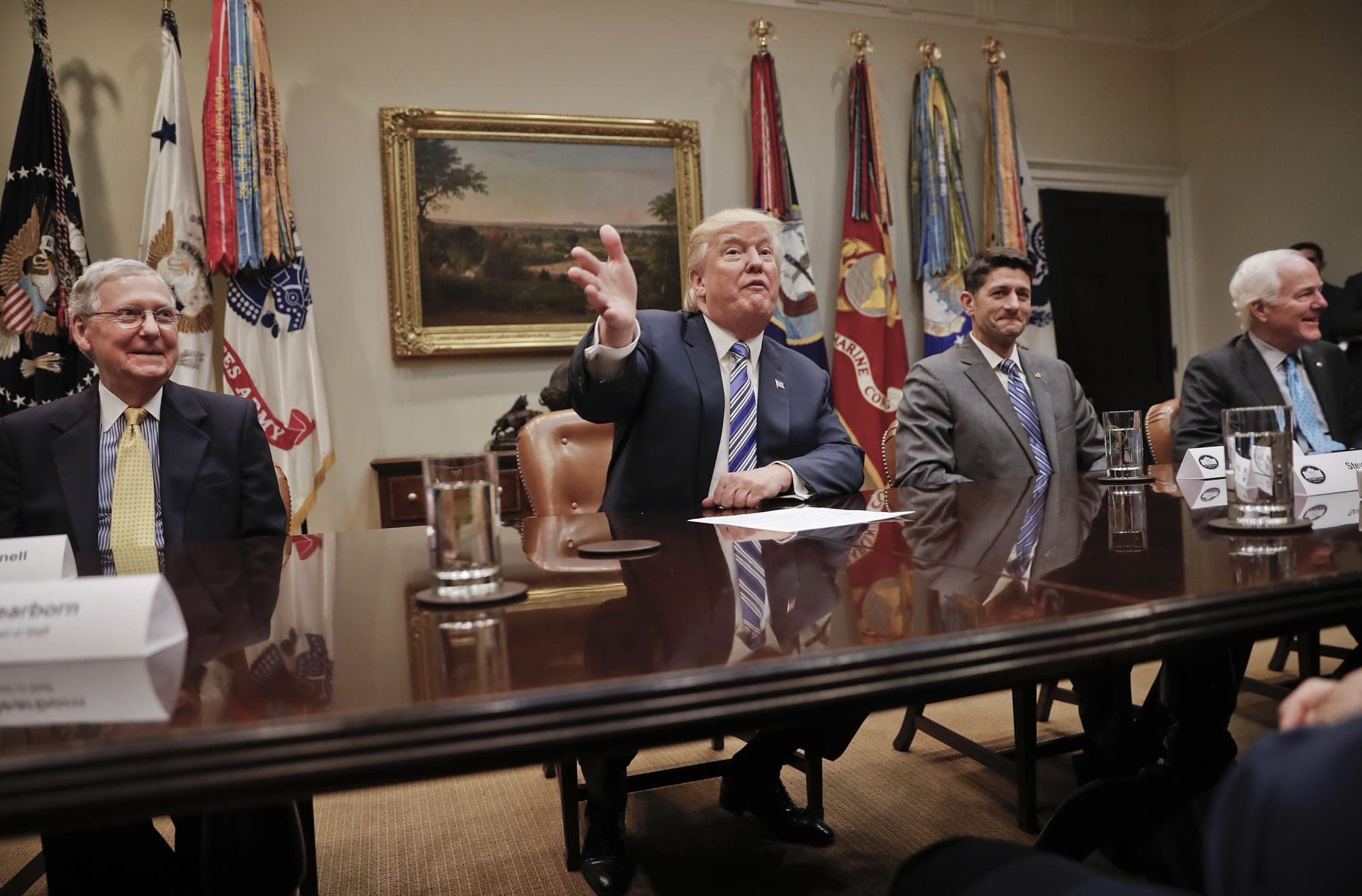 President Donald Trump, center, gestures during a meeting with House and Senate Leadership in the Roosevelt Room of the White House in Washington, Tuesday, June 6, 2017. With Trump are from left, Senate Majority Leader Mitch McConnell of Ky., House Speaker Paul Ryan of Wis., and Senate Majority Whip John Cornyn of Texas.