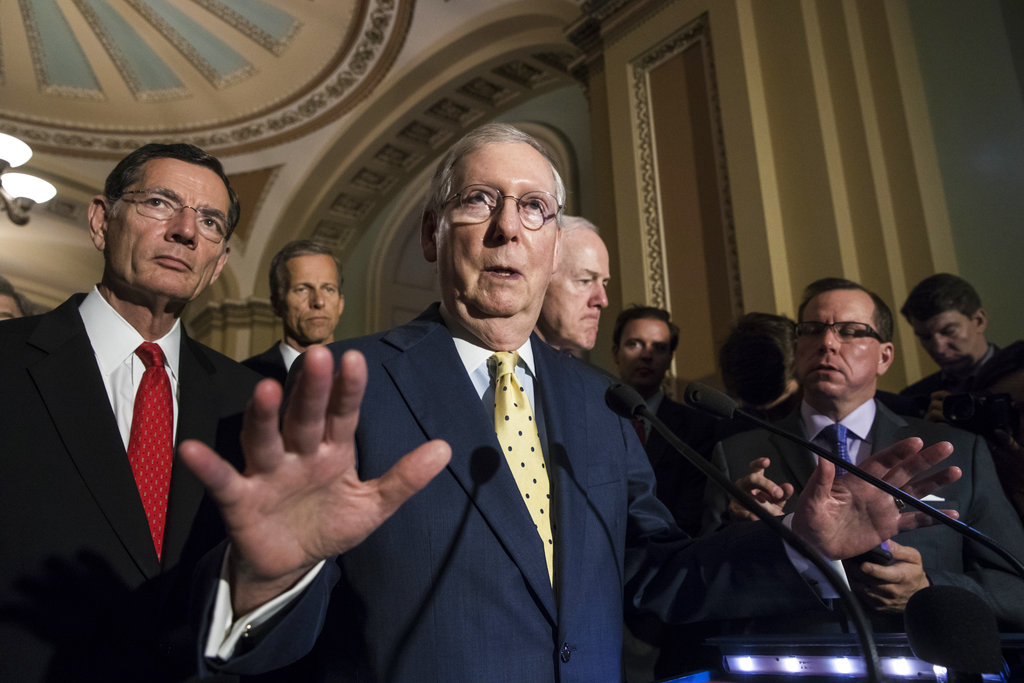 Senate Majority Leader Mitch McConnell, R-Ky., joined by, from left, Sen. John Barrasso, R-Wyo., Sen. John Thune, R-S.D., and Majority Whip John Cornyn, R-Texas, speaks following a closed-door strategy session, at the Capitol in Washington, Tuesday, June 20, 2017. Sen. McConnell says Republicans will have a "discussion draft" of a GOP-only bill scuttling former President Barack Obama's health care law by Thursday. (AP Photo/J.