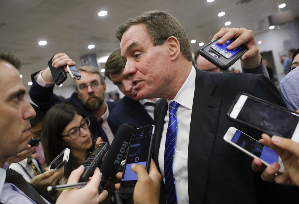 Senate Intelligence Committee Vice Chairman Sen. Mark Warner, D-Va., whose panel is investigating Russian interference in the 2016 election, speaks with reporters after final votes for the week, at the Capitol in Washington, Thursday, June 22, 2017. Warner responded to President Donald Trump's tweet that there are no recordings of his private conversations with fired FBI director James Comey, saying, "This administration never ceases to amaze me." (AP Photo/J.