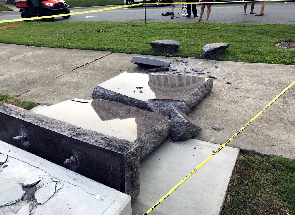 The new Ten Commandments monument outside the state Capitol in Little Rock, Ark., is blocked off Wednesday morning, June 28, 2017, after someone crashed into it with a vehicle, less than 24 hours after the privately funded monument was installed on the Capitol grounds. Authorities arrested a male suspect.