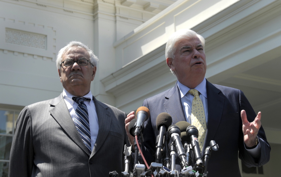 Then-Senate Banking Committee Chairman Sen. Christopher Dodd, D-Conn., right, and then- House Financial Services Committee Chairman Rep. Barney Frank, D-Mass., speak in May 2010 to reporters outside the White House in Washington, after their meeting with President Barack Obama.