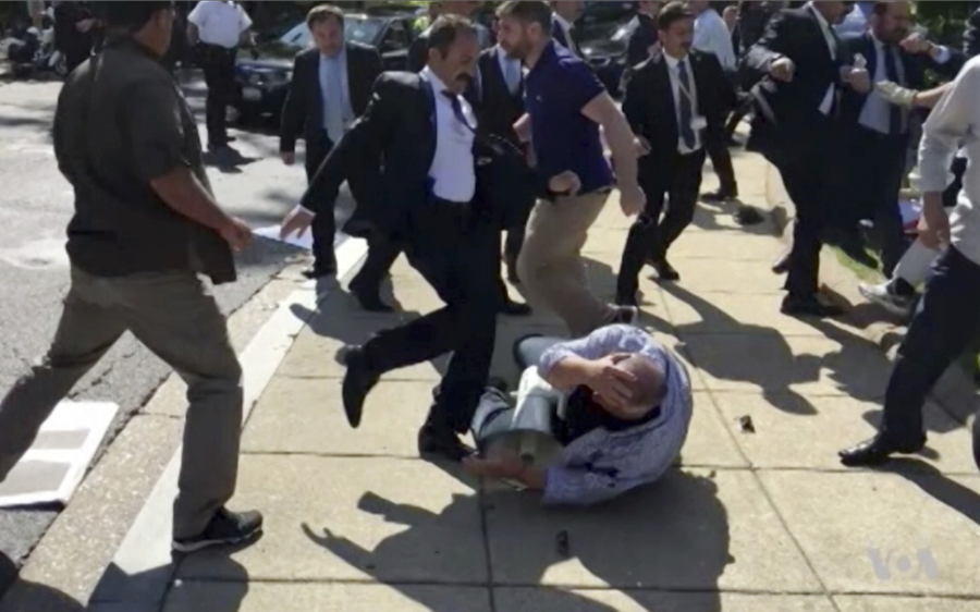 In this image from video, members of Turkish President Recep Tayyip Erdogan’s security detail are shown violently reacting to protesters during Erdogan’s trip to Washington.