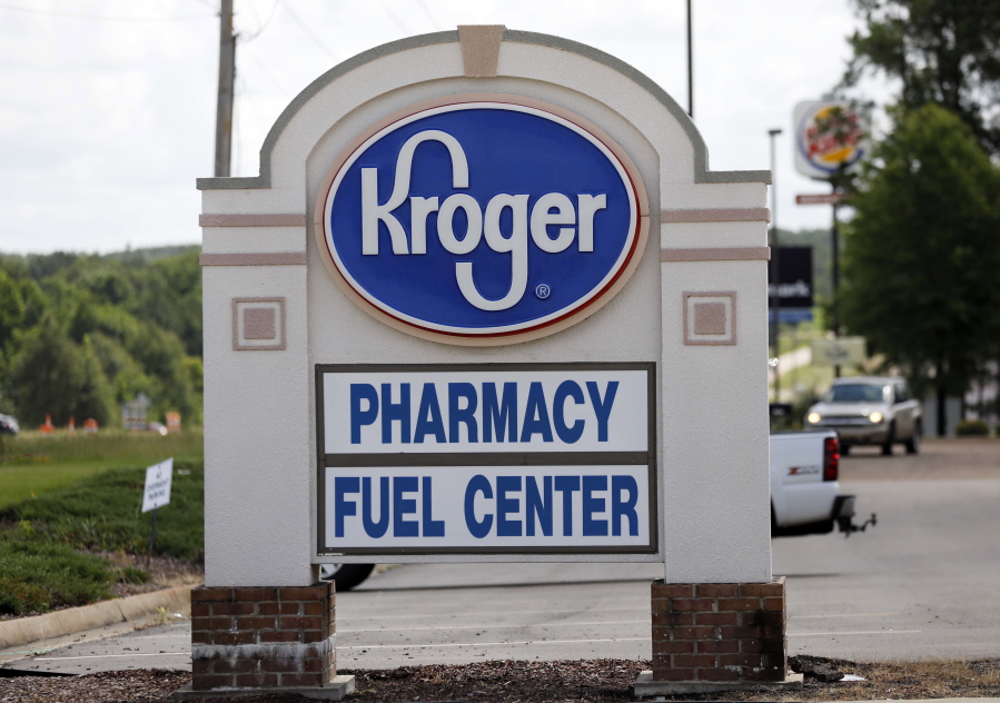 A Kroger grocery store sign promotes its pharmacy and fuel center at its Flowood, Miss., location. Rogelio V.