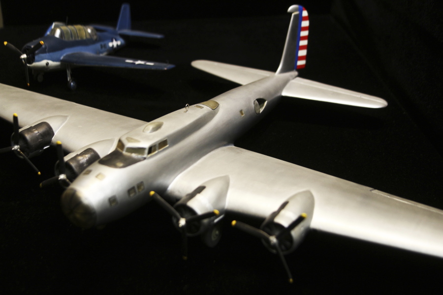 This Thursday, May 25, 2017 photo, shows wooden airplane models Chuck Johnson built as a kid during World War II, now on display as part of Battle of Midway exhibit at the Klamath County Museum in Klamath Falls, Ore., almost 75 years after their original construction. Johnson used a World War II-era citizens aircraft spotters guide to make the models, which he still has to this day.