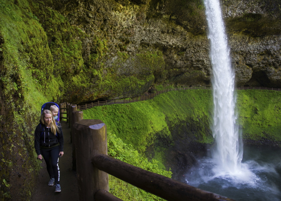 Alivea Binder and her son, Rowdy Briggs, hike May 31 in Silver Falls State Park east of Salem, Ore., as they close in on their goal of completing 50 hikes to Northwest waterfalls in Rowdy’s first year of life.