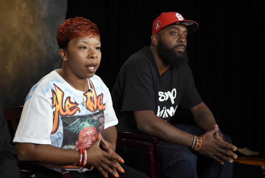 The parents of Michael Brown, Lezley McSpadden, left, and Michael Brown Sr., sit for an interview with The Associated Press in Washington in 2014. The city attorney in Ferguson, Missouri, said Friday, June 23, 2017, that the city’s insurance company paid $1.5 million to settle a lawsuit filed by the family of Michael Brown.
