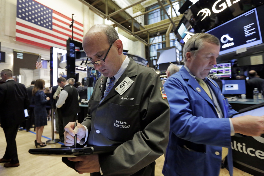 Traders Andrew Silverman, left, and James Lamb work on the floor of the New York Stock Exchange, Thursday, June 22, 2017.
