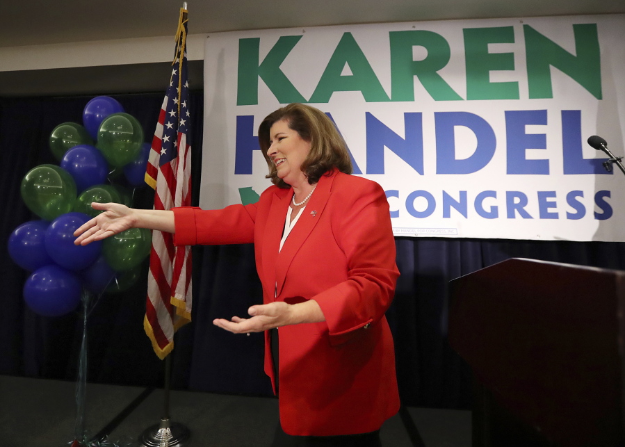 Karen Handel makes an early appearance to thank her supporters after the first returns come in during her election night party in the 6th District race with Jon Ossoff on Tuesday, June 20, 2017, in Atlanta.