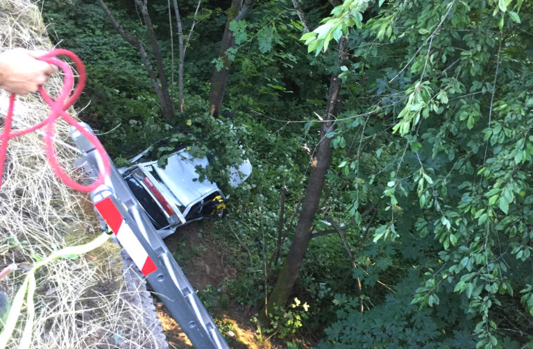 Firefighters worked for about a half an hour to reach an injured driver who went down an embankment and was ejected in a crash on Interstate 5 Thursday evening.