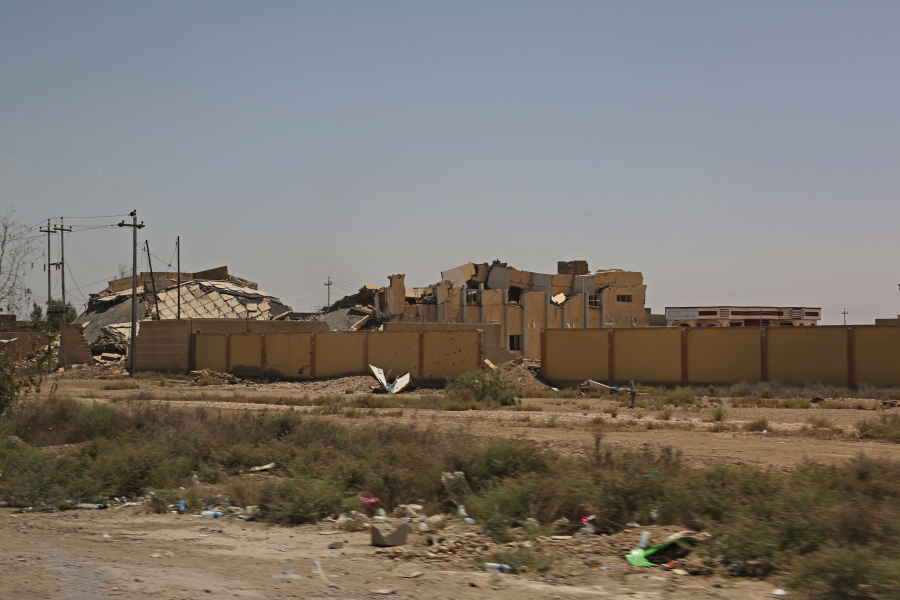 Destroyed buildings are seen Thursday in Fallujah, Iraq. Residents of Fallujah in Iraq’s Sunni heartland are still struggling to rebuild nearly a year after their neighborhoods were declared liberated from the Islamic State group.