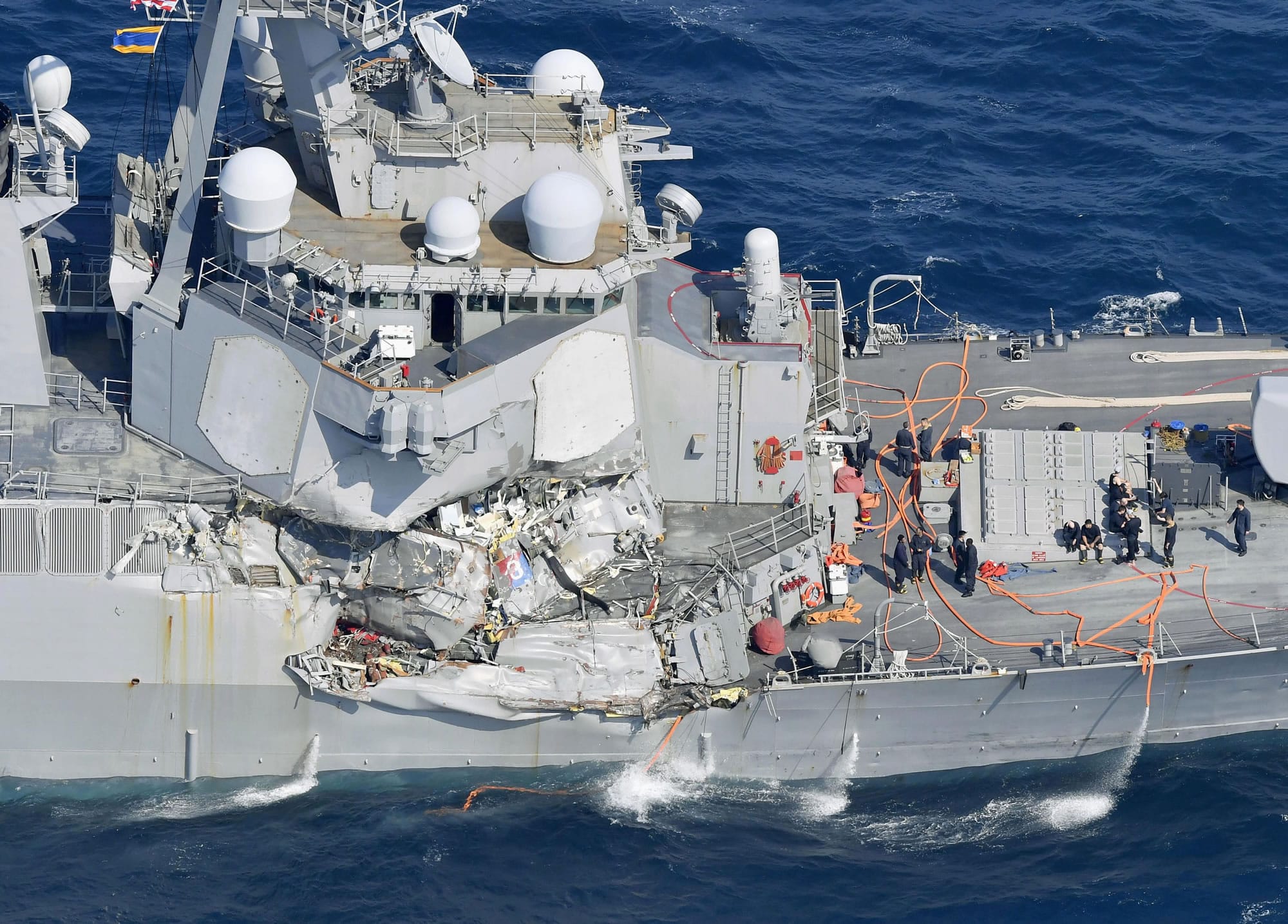 The damage of the right side of the USS Fitzgerald is seen off Shimoda, Shizuoka prefecture, Japan, after the Navy destroyer collided with a merchant ship, Saturday,  June 16, 2017.  The U.S. Navy says the USS Fitzgerald suffered damage below the water line on its starboard side after it collided with a Philippine-flagged merchant ship.
